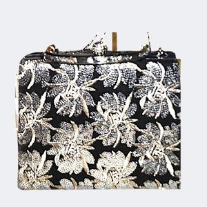 d'margeaux clutch is black with gold and silver sequin & thread detailing.